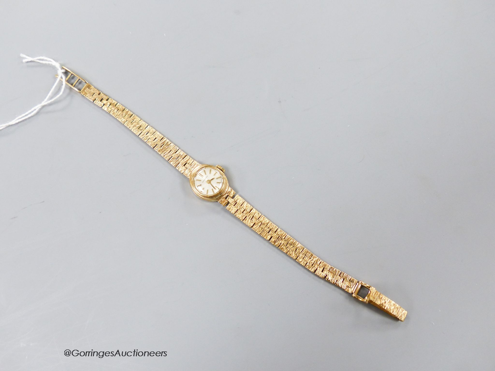 A lady's 9ct gold Longines wristwatch, overall 18.5cm, gross 18.5 grams.